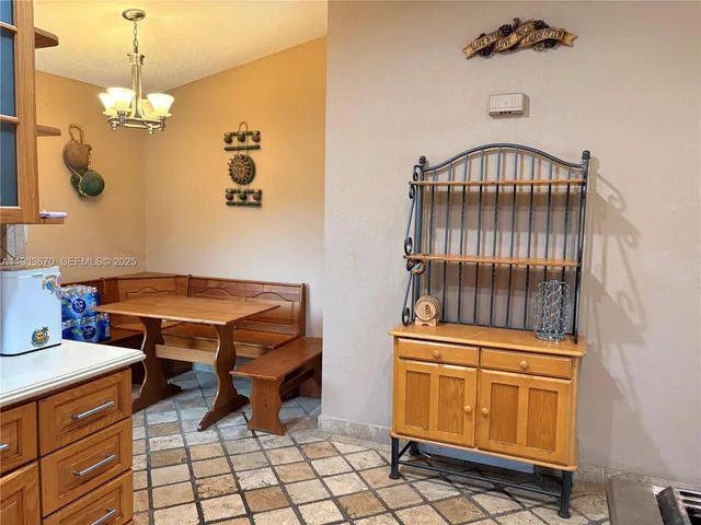 a bedroom with table and chairs