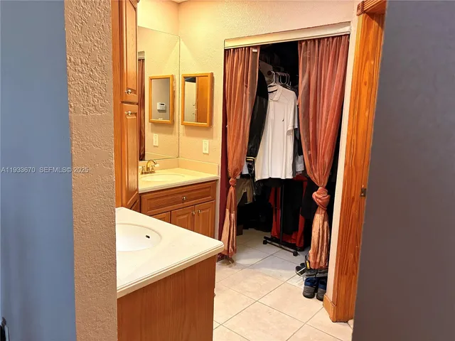 a bathroom with a tub and a sink