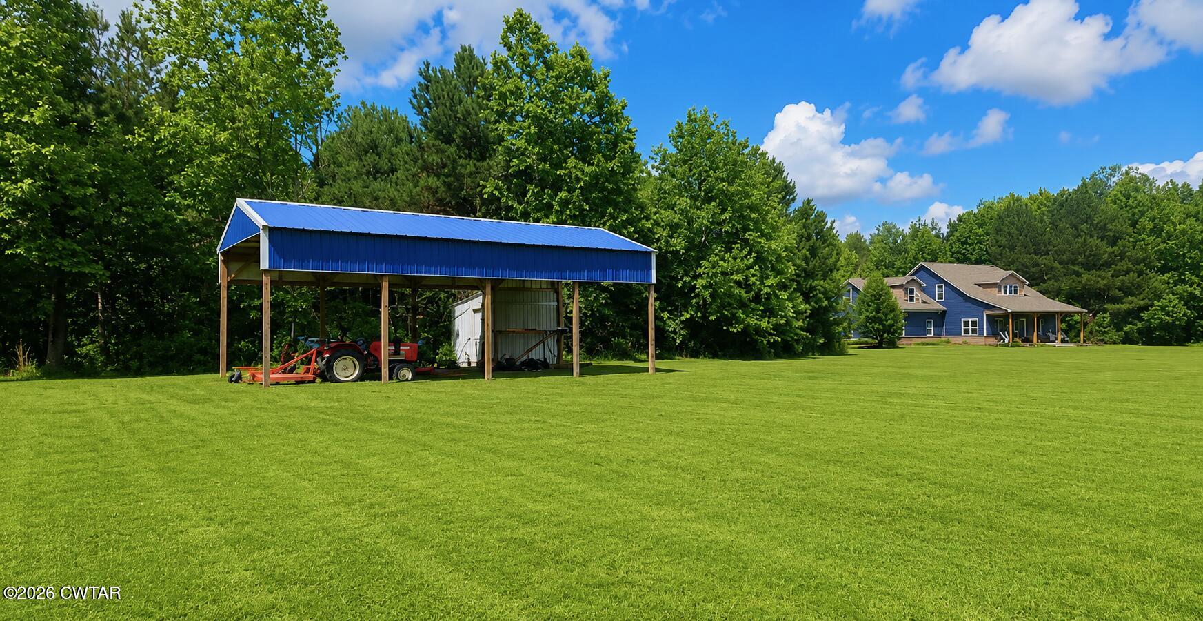 1586 Love Road Bells, TN 38006 - Photo 60 of 61 a view of a big house with a big yard and large trees