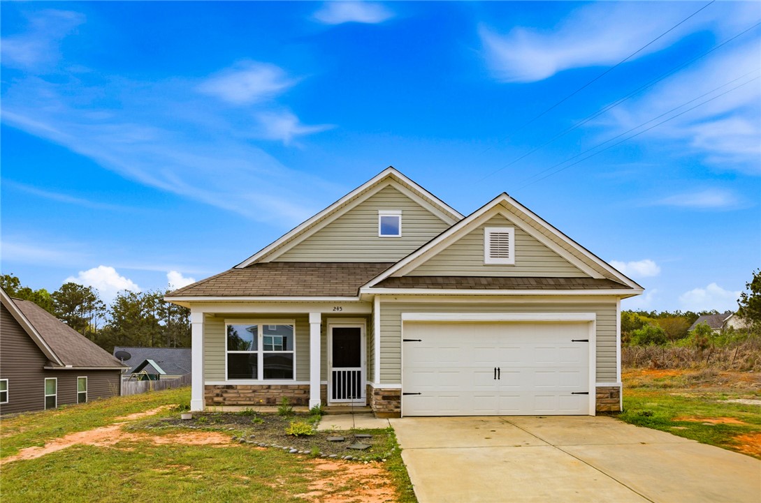 245 Maple Grove Road Seneca, SC 29678 - Photo 2 of 40 This charming home offers comfortable living with a welcoming facade and convenient attached garage.