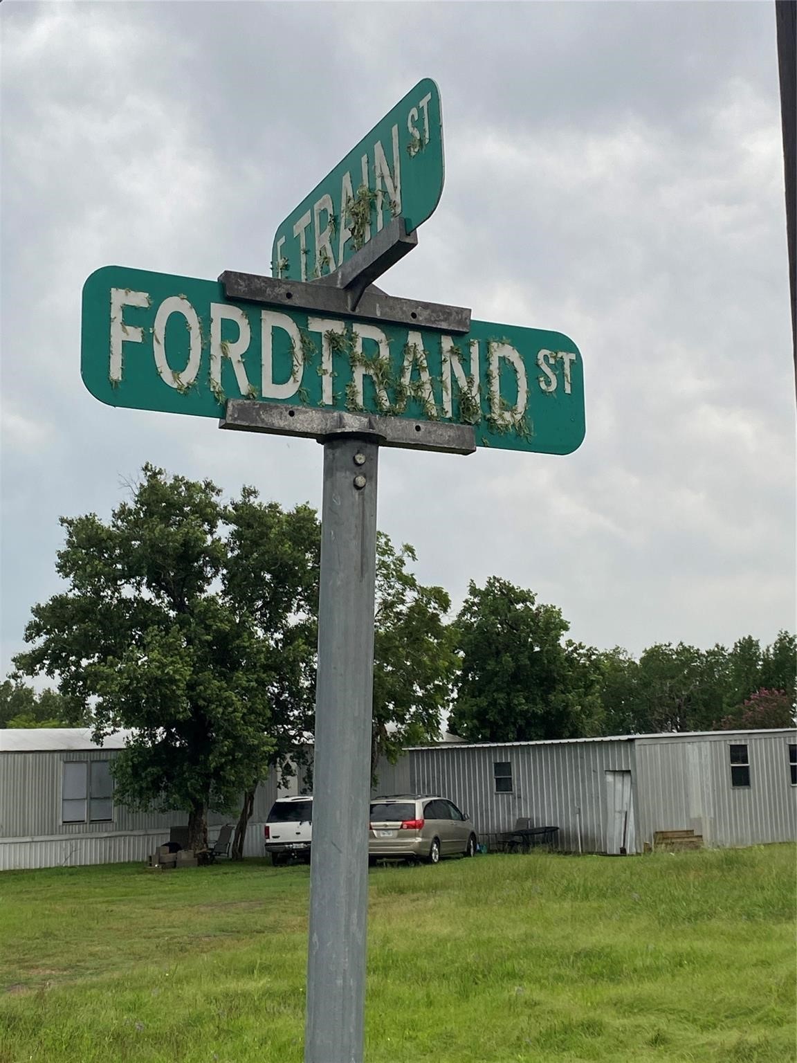 406 Fordtrant Ellinger, TX 78938 - Photo 14 of 17 a view of a street sign under a large tree
