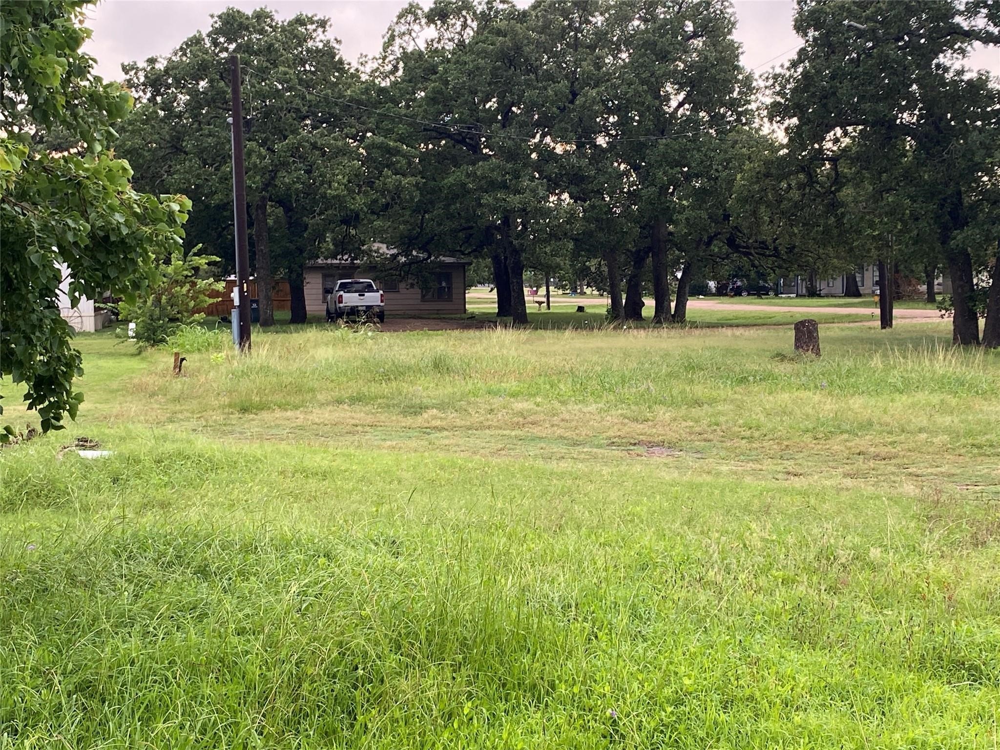 406 Fordtrant Ellinger, TX 78938 - Photo 2 of 17 a view of outdoor space with deck and garden