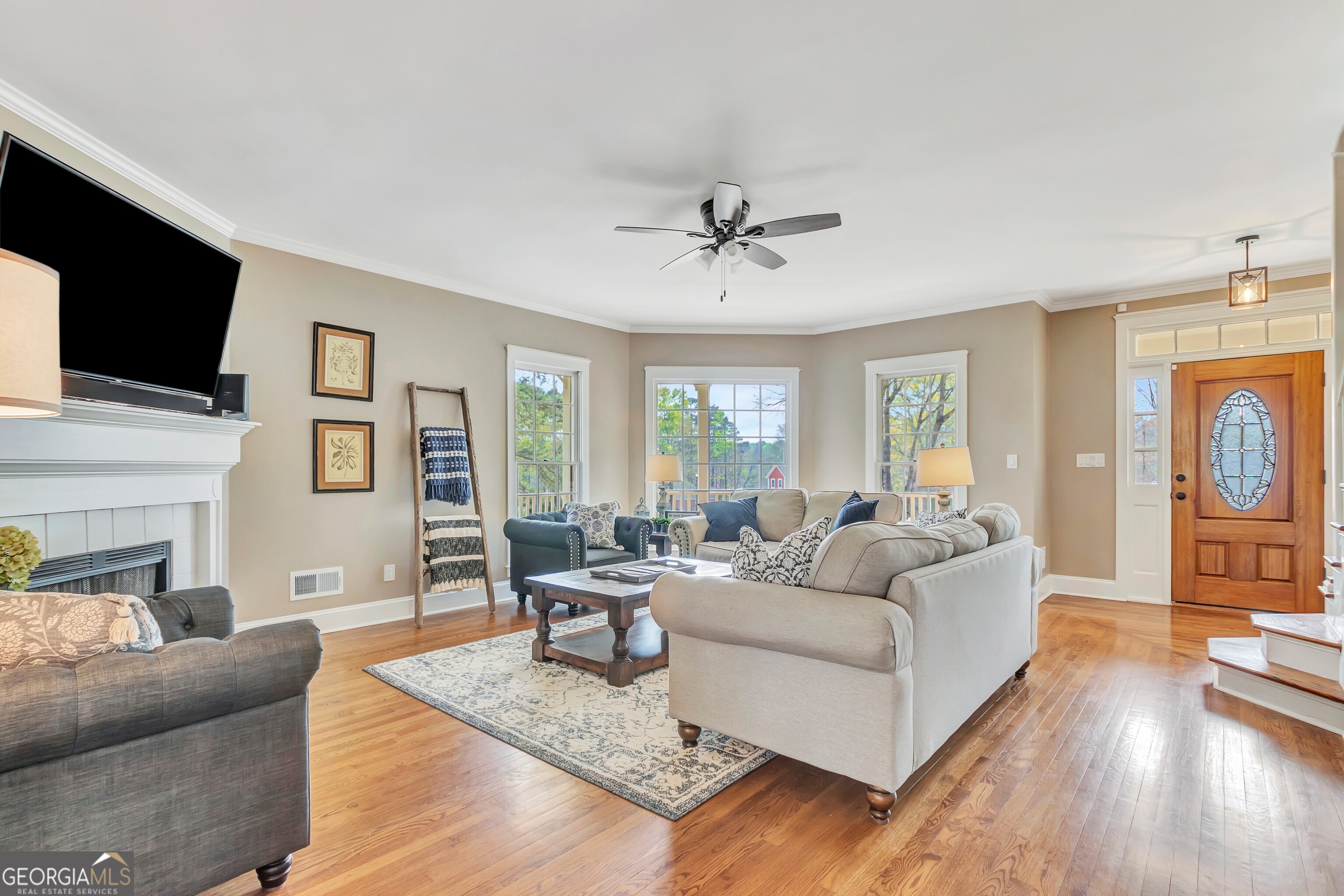 388 Swanson Road Tyrone, GA 30290 - Photo 11 of 62 a living room with fireplace furniture and a flat screen tv