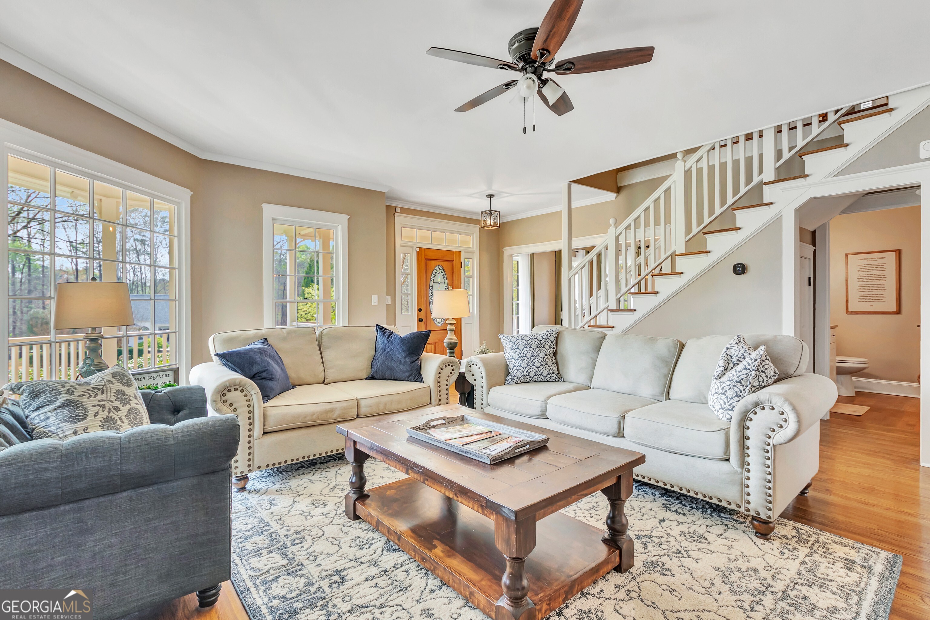 388 Swanson Road Tyrone, GA 30290 - Photo 12 of 62 a living room with furniture a ceiling fan and a window