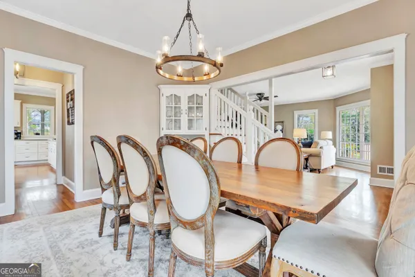 a view of a dining room with furniture wooden floor and flat screen tv