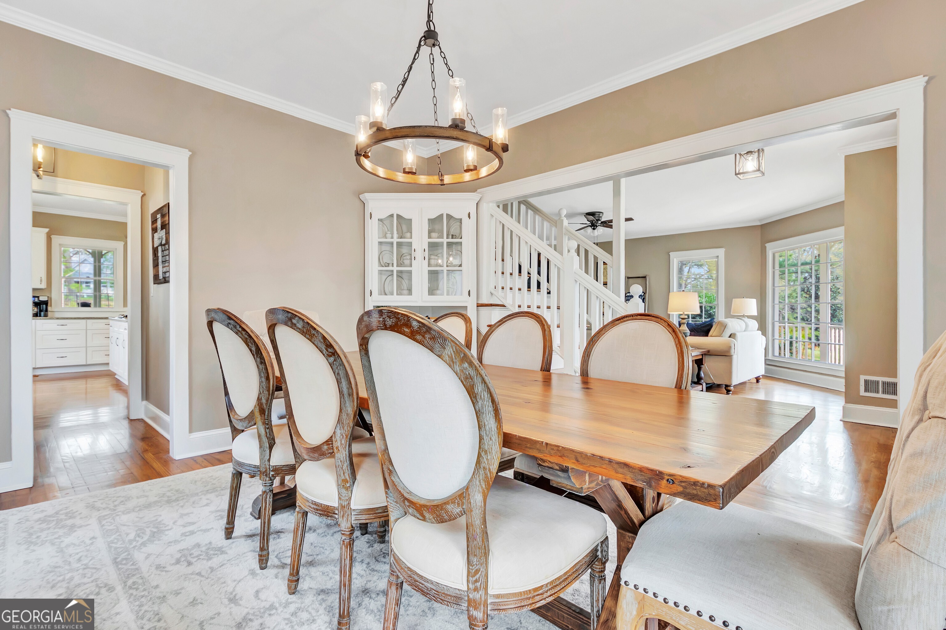 388 Swanson Road Tyrone, GA 30290 - Photo 15 of 62 a dining room with furniture a chandelier and wooden floor