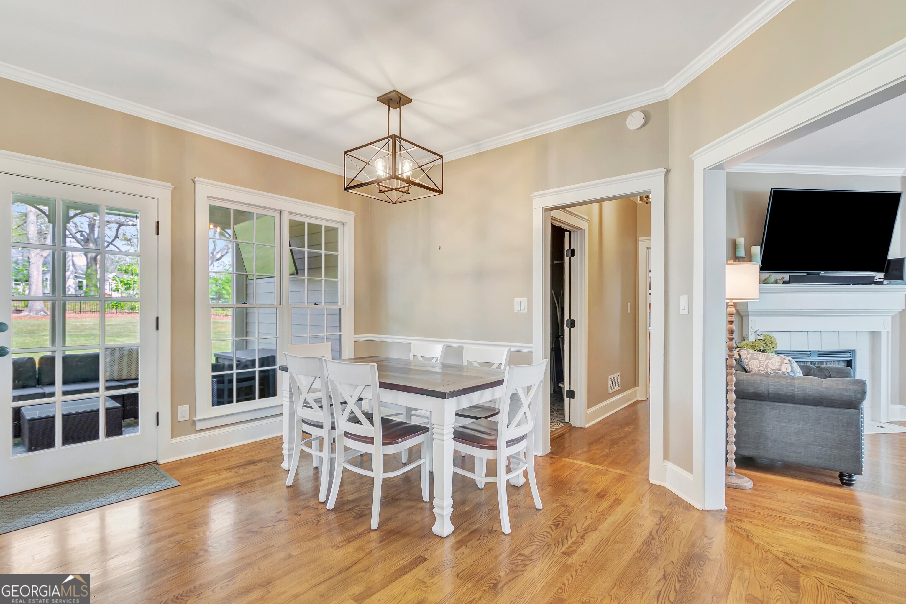 388 Swanson Road Tyrone, GA 30290 - Photo 17 of 62 a view of a dining room with furniture wooden floor and flat screen tv