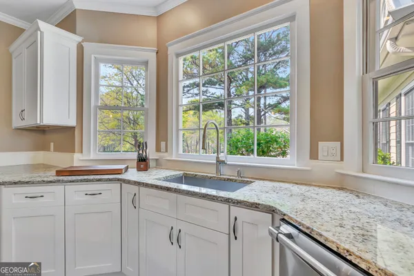 a bathroom with a bathtub sink and mirror