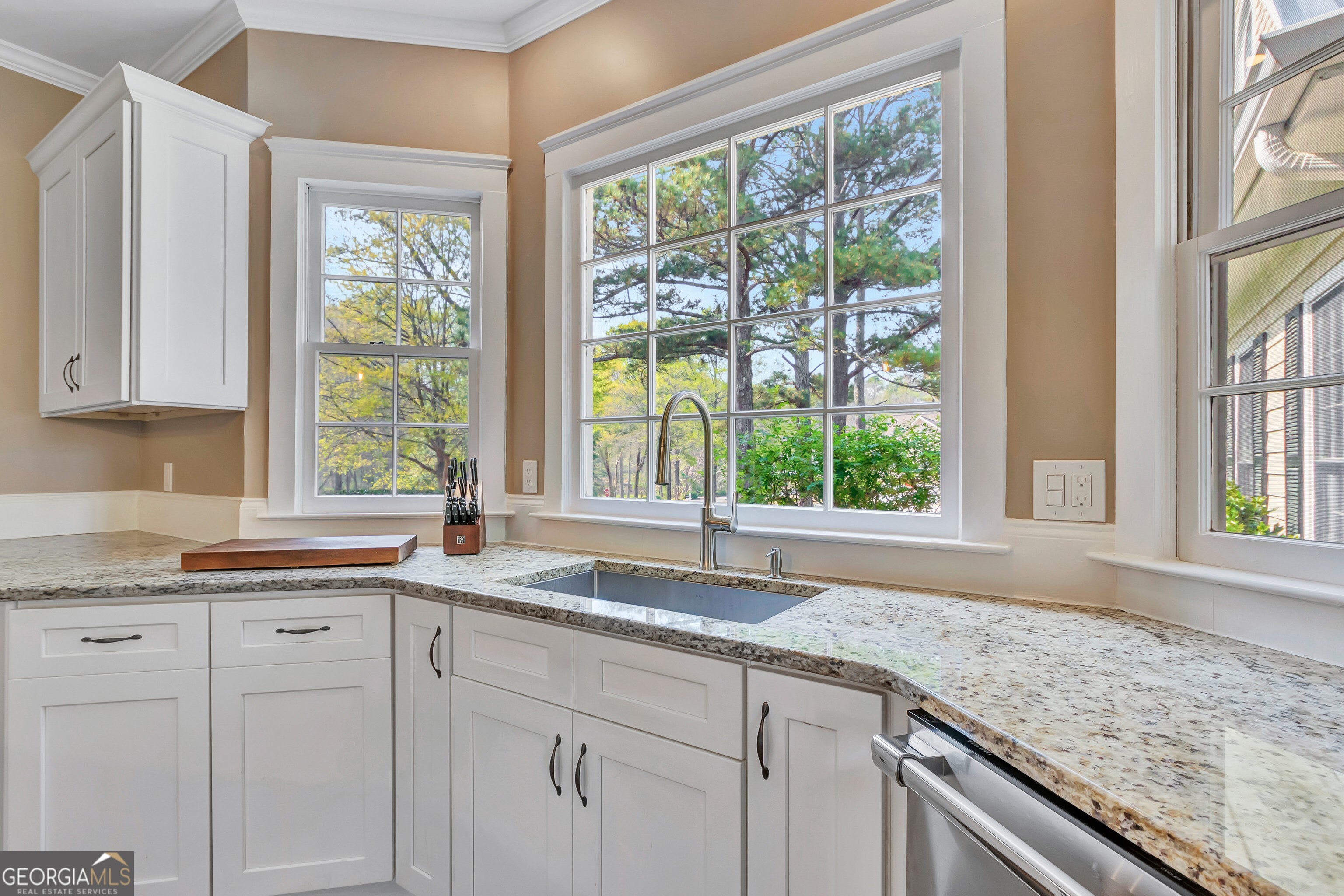 388 Swanson Road Tyrone, GA 30290 - Photo 23 of 62 a kitchen with granite countertop sink and window