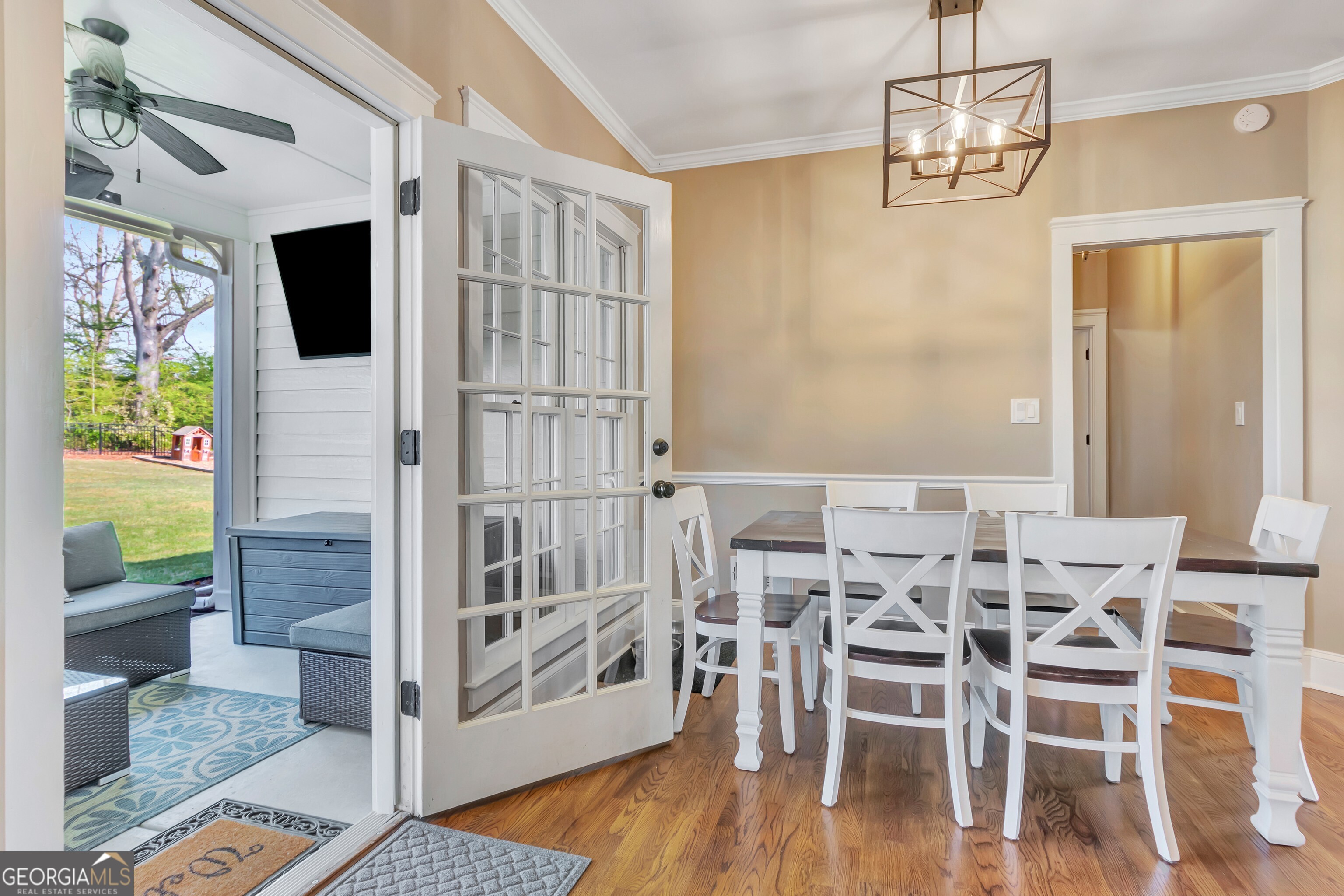 388 Swanson Road Tyrone, GA 30290 - Photo 24 of 62 a view of a dining room with furniture wooden floor and chandelier