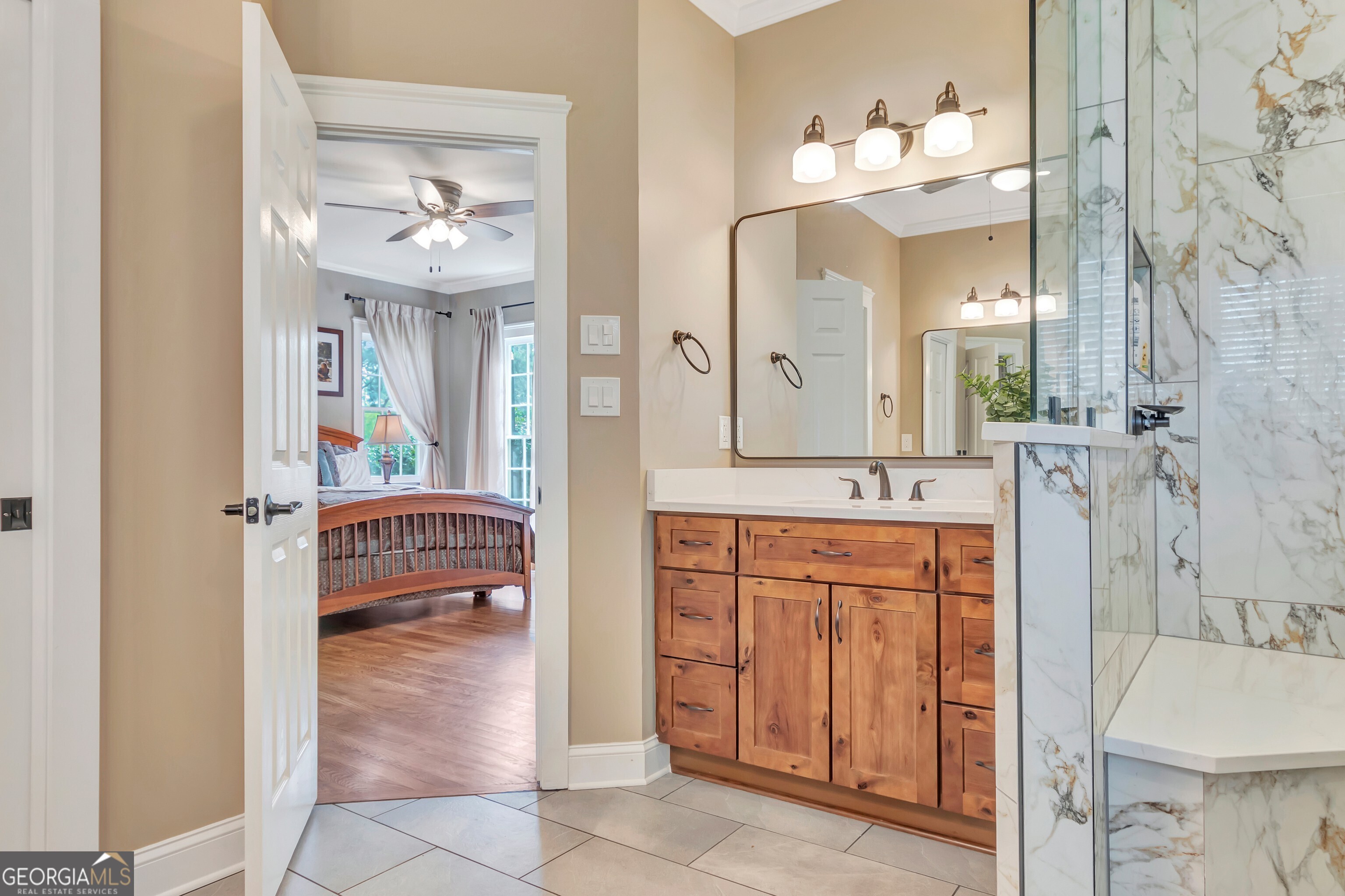 388 Swanson Road Tyrone, GA 30290 - Photo 30 of 62 a spacious bathroom with a double vanity sink and a mirror