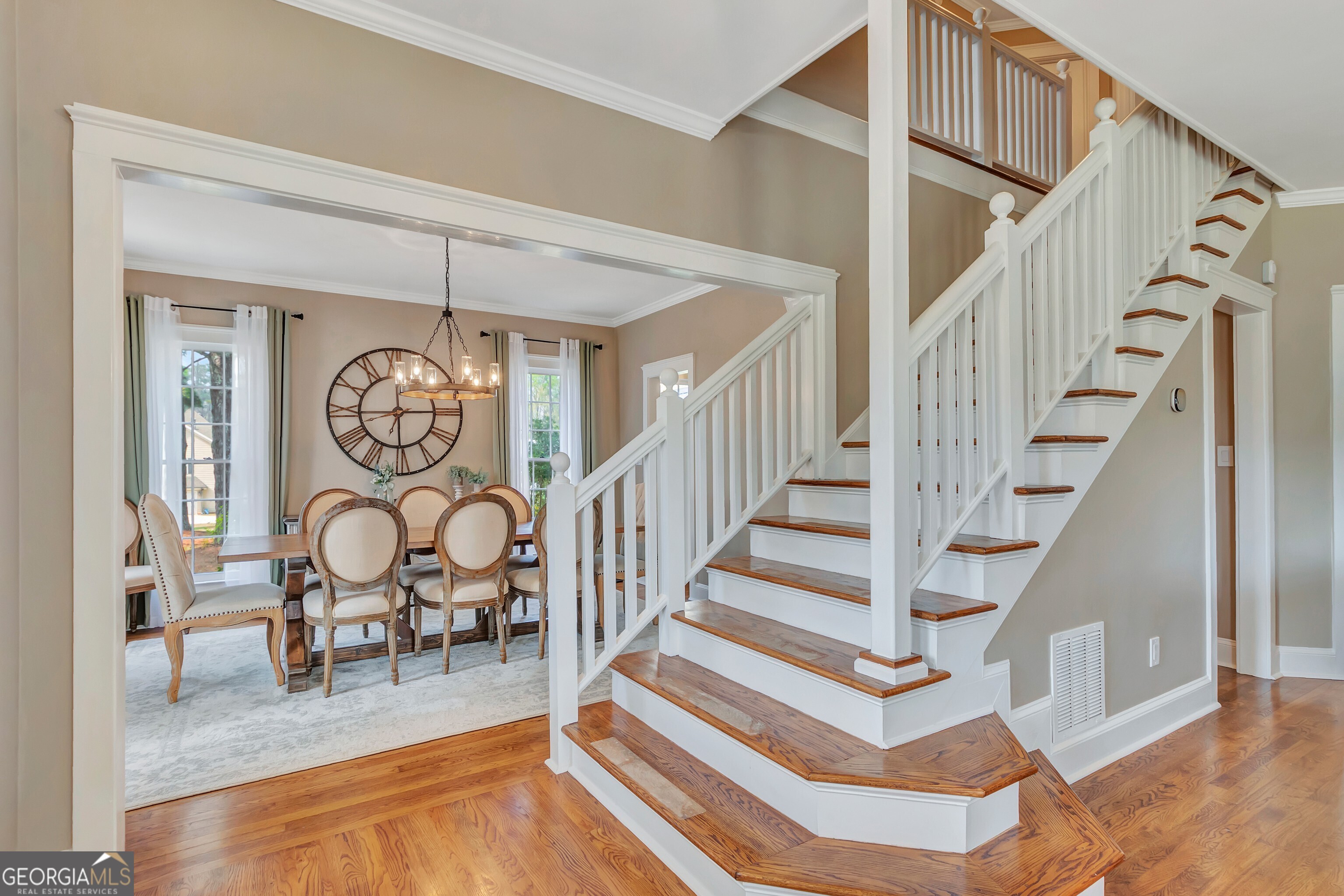 388 Swanson Road Tyrone, GA 30290 - Photo 31 of 62 a view of entryway dining room and hall with wooden floor