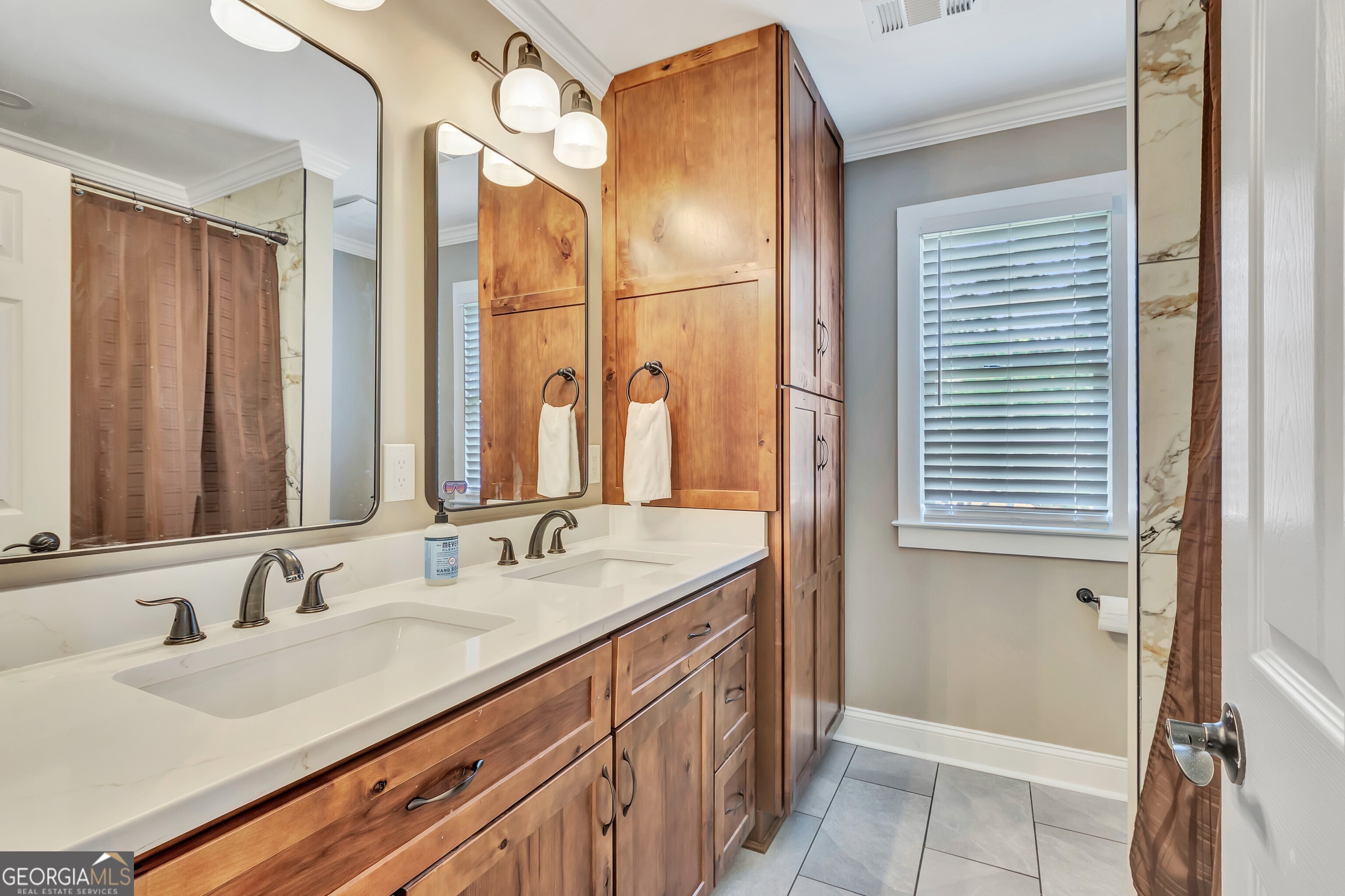 388 Swanson Road Tyrone, GA 30290 - Photo 37 of 62 a bathroom with a granite countertop sink and a mirror