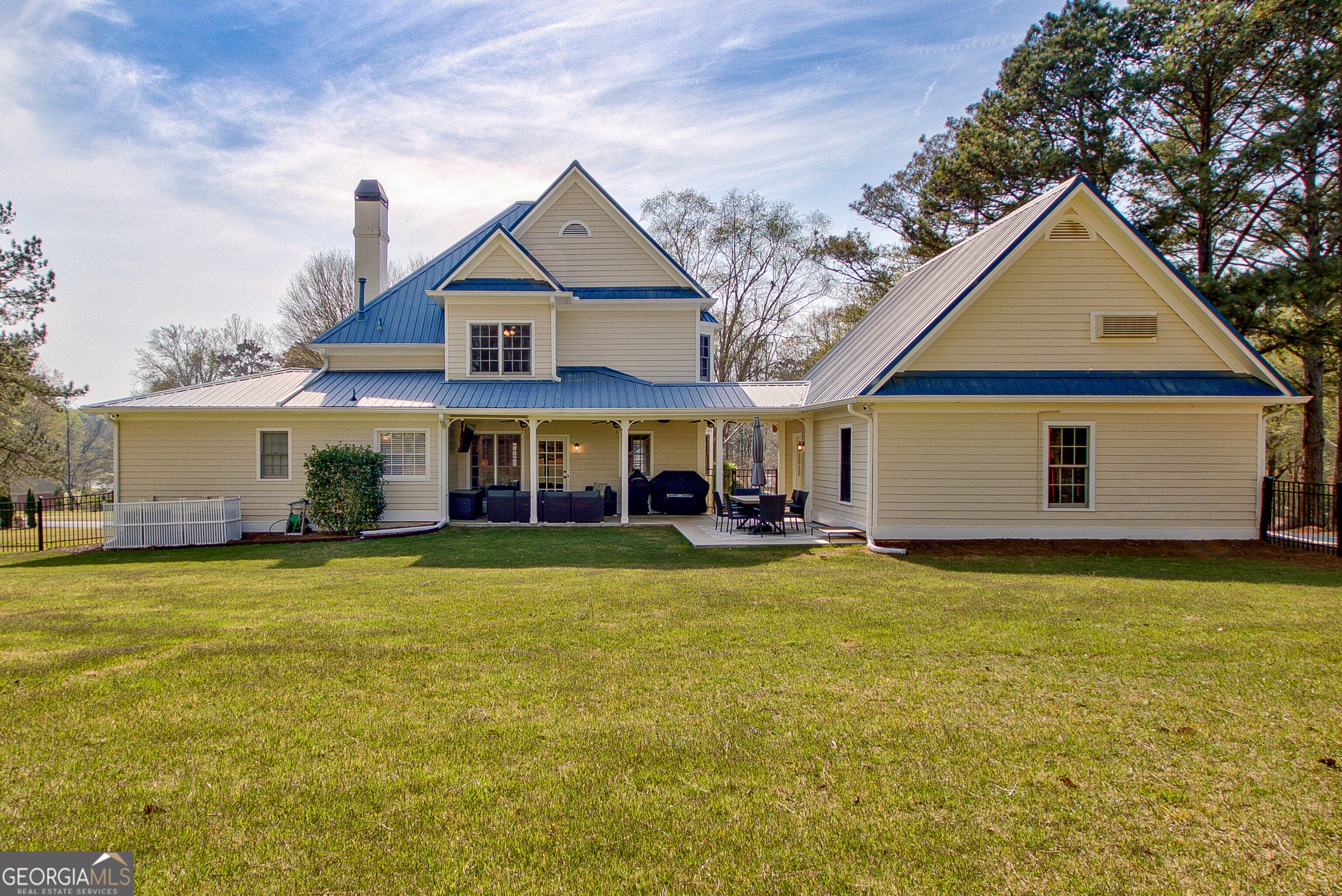388 Swanson Road Tyrone, GA 30290 - Photo 40 of 62 a front view of a house with swimming pool having outdoor seating