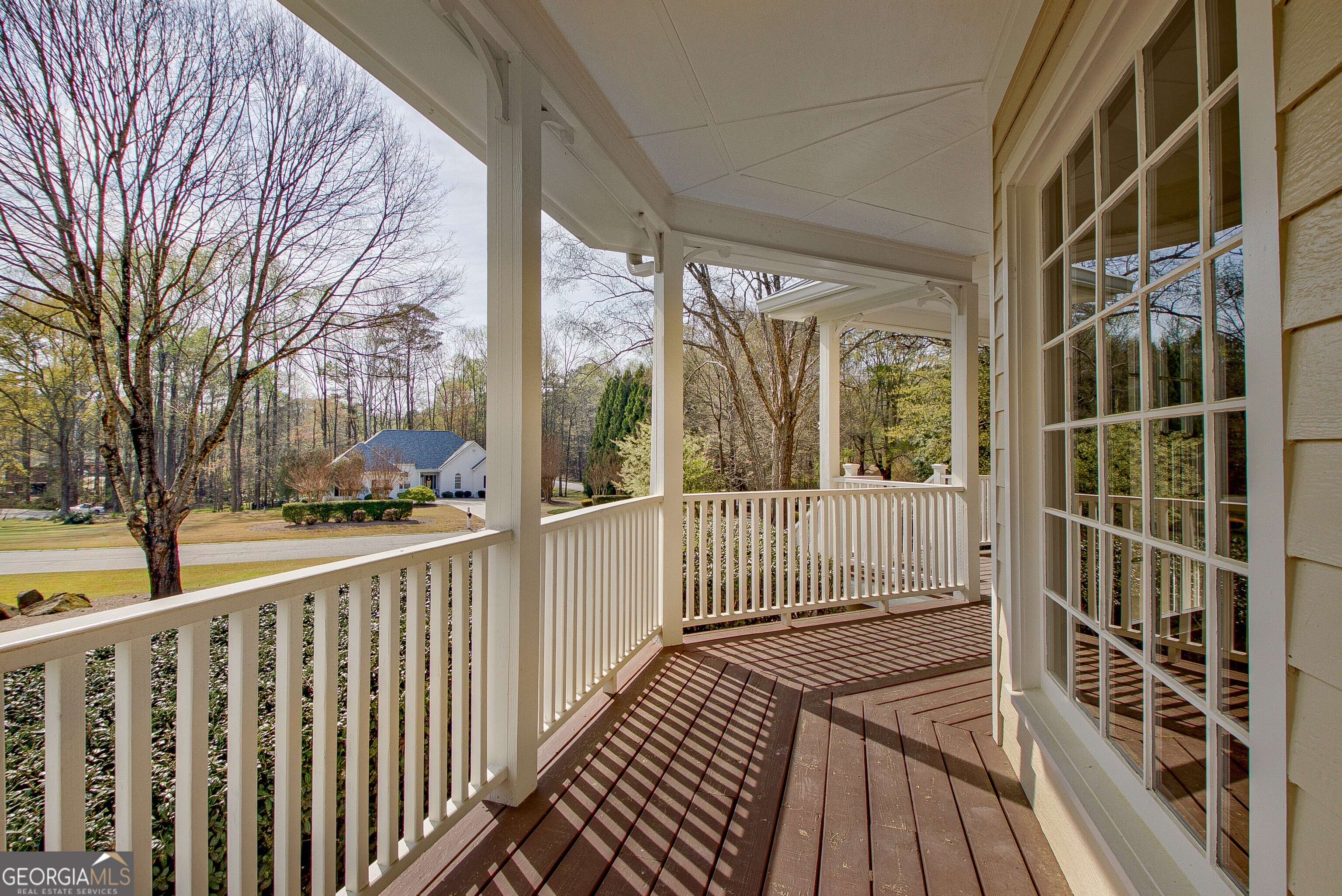 388 Swanson Road Tyrone, GA 30290 - Photo 4 of 62 a view of a balcony with wooden floor and fence