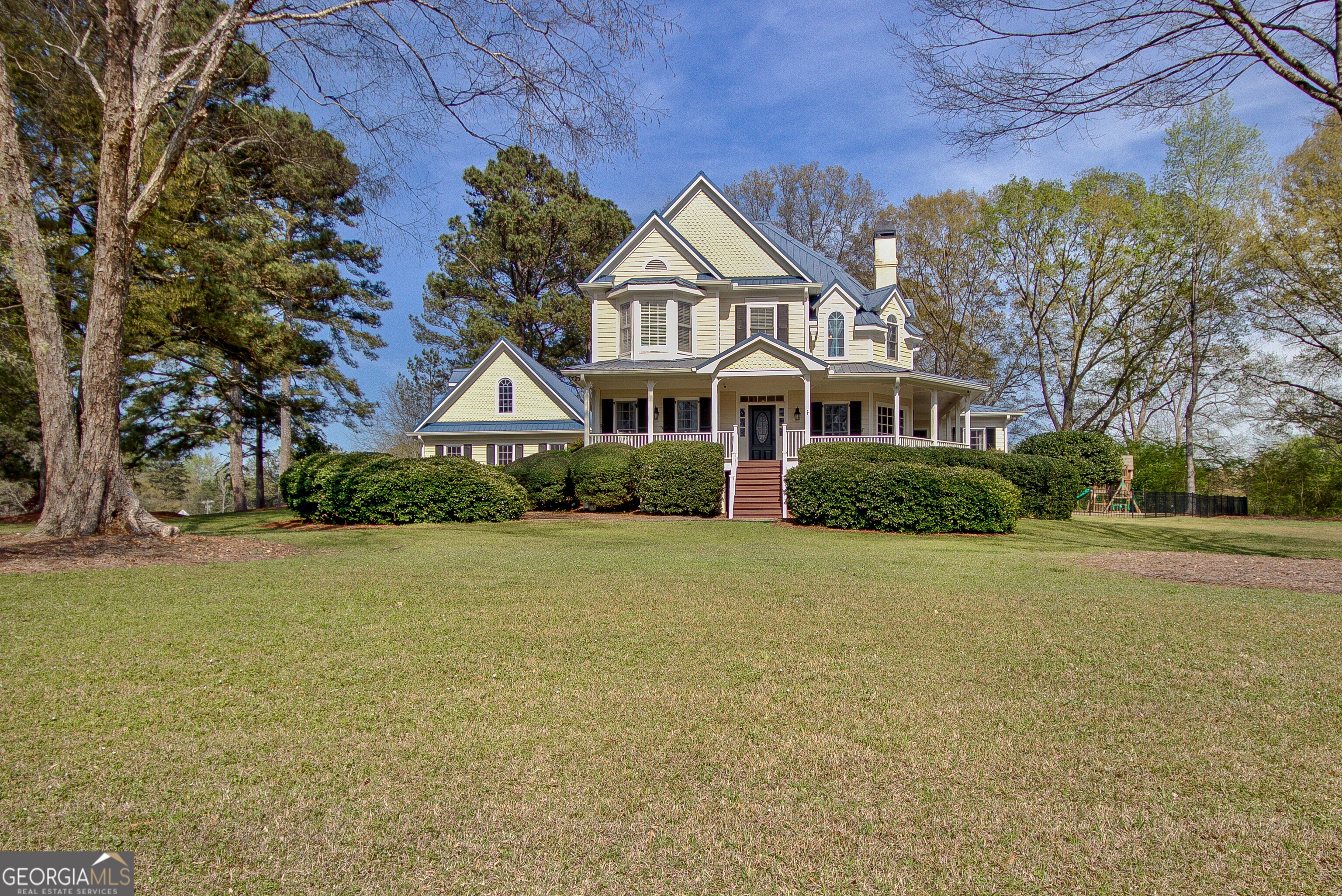 388 Swanson Road Tyrone, GA 30290 - Photo 51 of 62 a front view of a house with a garden