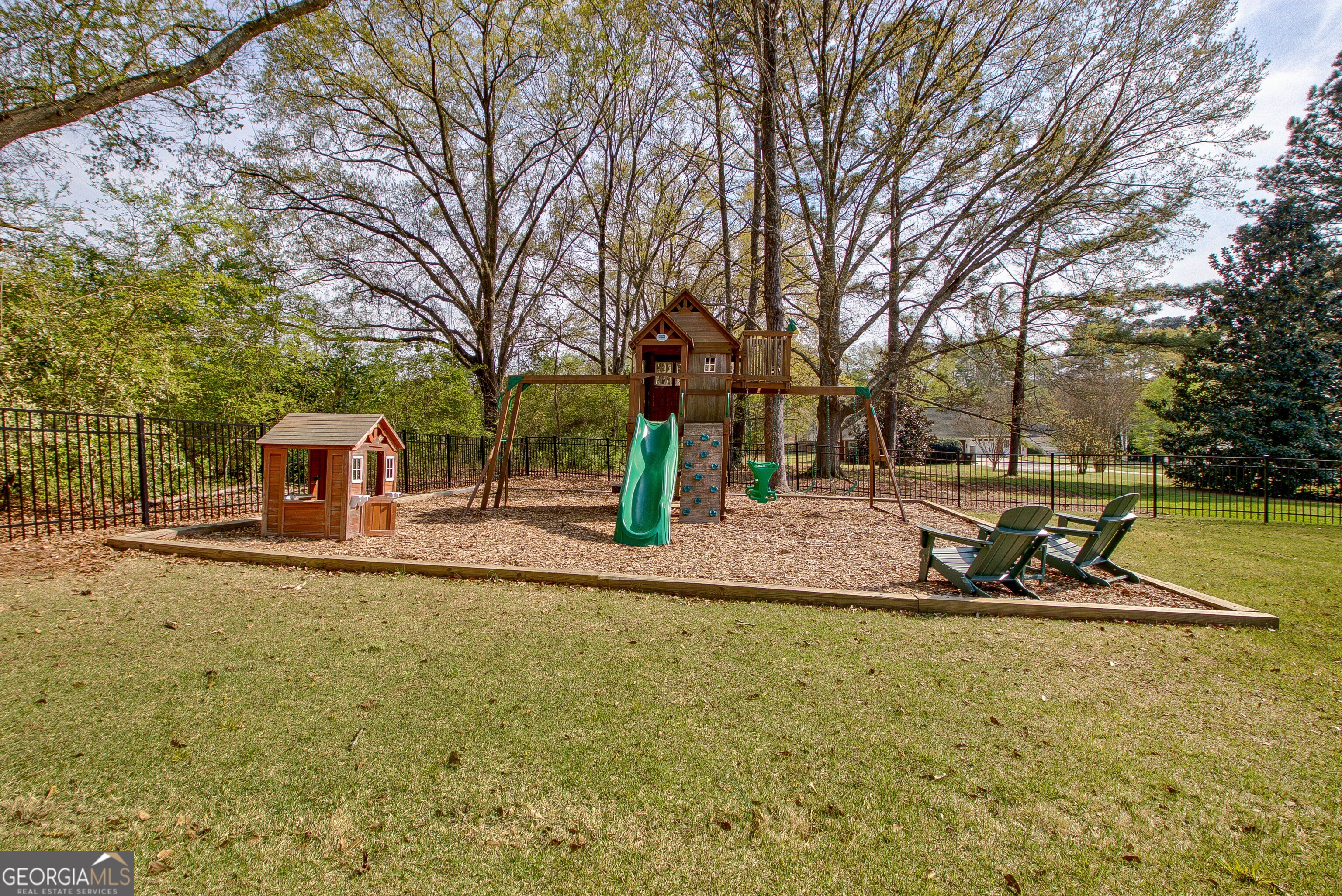 388 Swanson Road Tyrone, GA 30290 - Photo 55 of 62 a view of a playground with pool and sitting area
