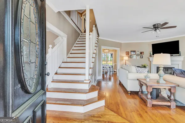 a living room with fireplace furniture and a flat screen tv
