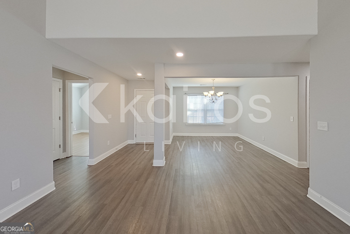228 Western Red Cedar Drive Springfield, GA 31329 - Photo 3 of 27 wooden floor in an empty room with a window