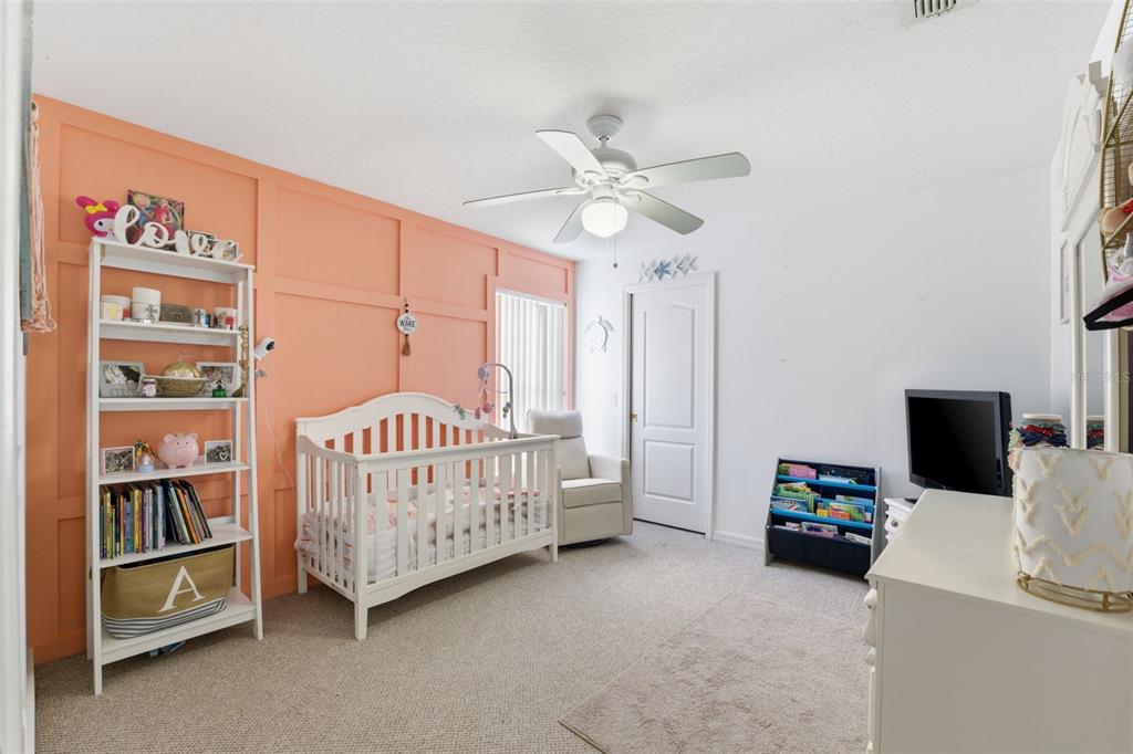 5220 Kirkwood Avenue Spring Hill, FL 34608 - Photo 28 of 67 a bedroom with furniture and a window