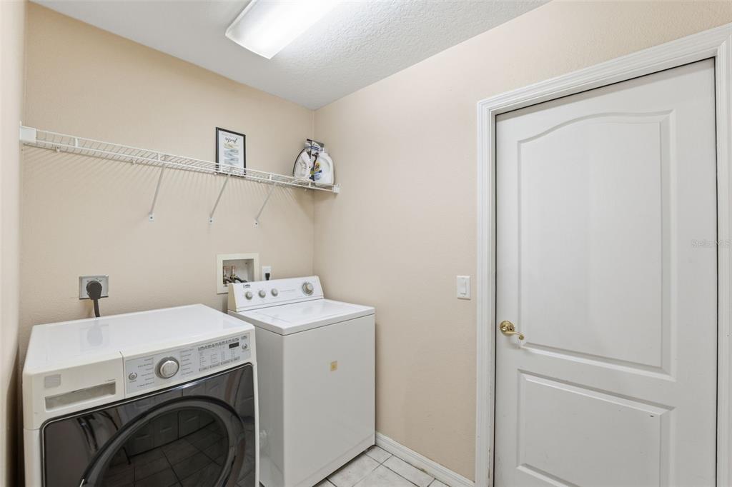 5220 Kirkwood Avenue Spring Hill, FL 34608 - Photo 33 of 67 a utility room with dryer and washer