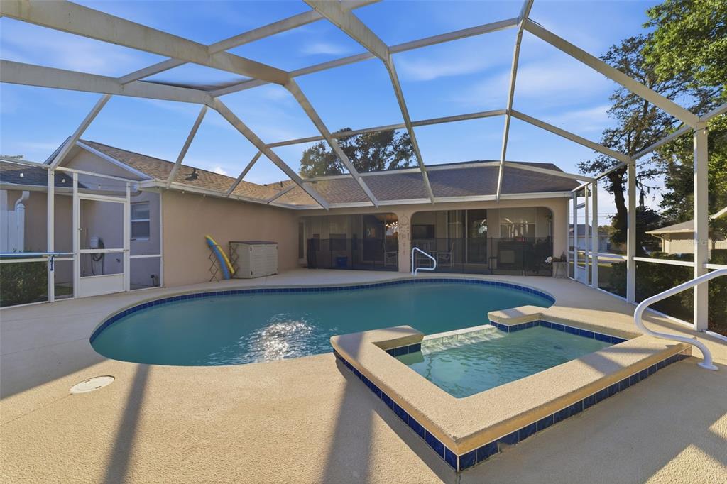 5220 Kirkwood Avenue Spring Hill, FL 34608 - Photo 39 of 67 a view of a house with pool and chairs