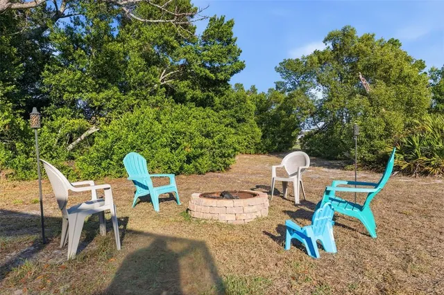 a front view of house with yard and swimming pool