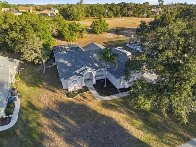an aerial view of residential building and lake