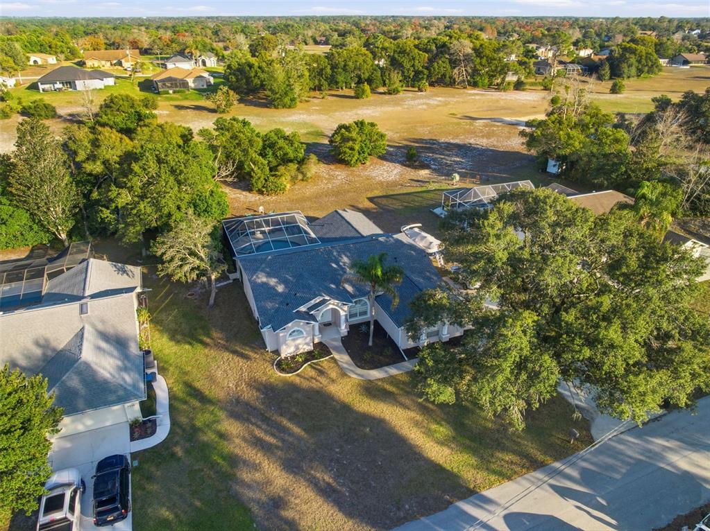 5220 Kirkwood Avenue Spring Hill, FL 34608 - Photo 48 of 67 an aerial view of residential houses with outdoor space
