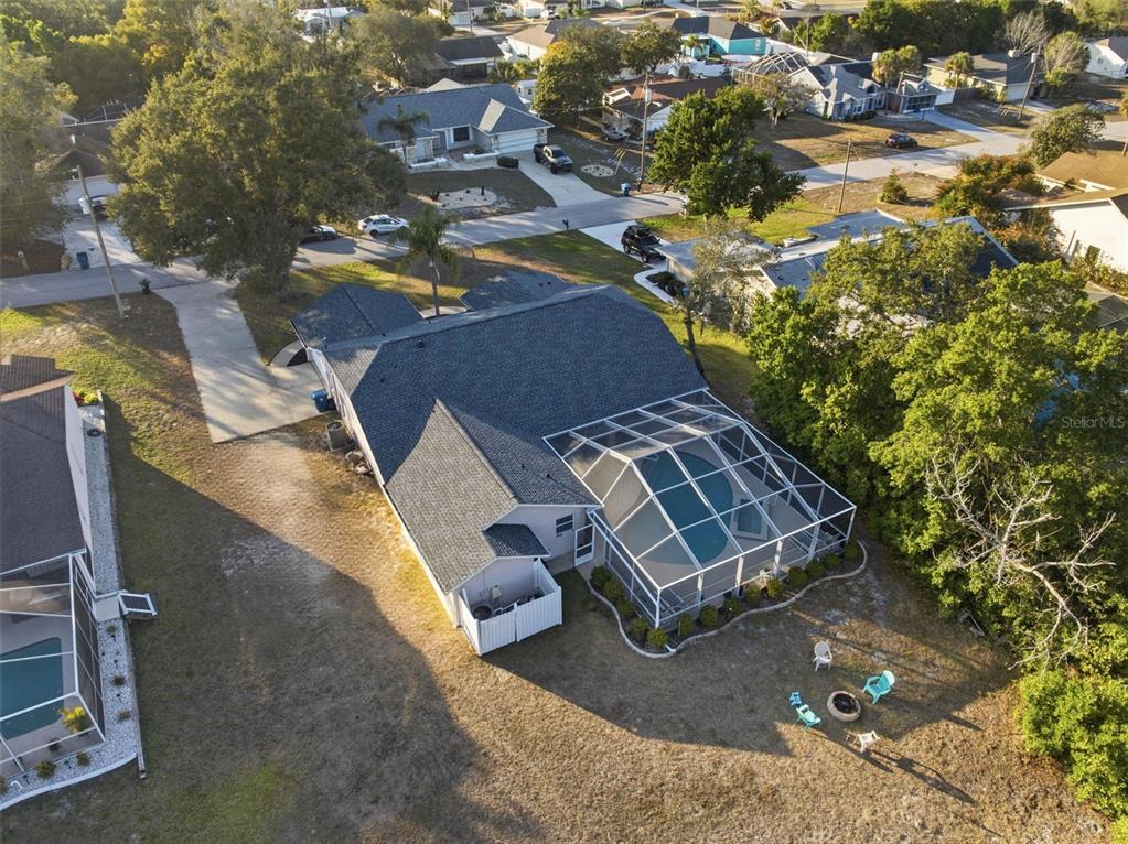 5220 Kirkwood Avenue Spring Hill, FL 34608 - Photo 50 of 67 an aerial view of a house with a yard and lake view