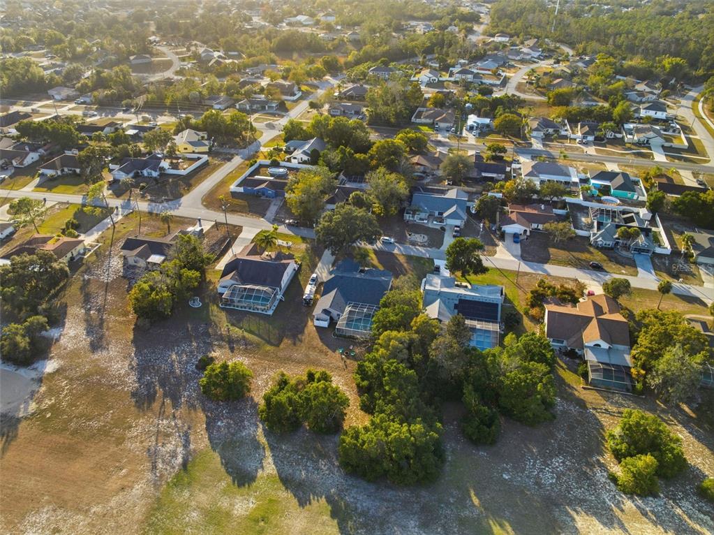 5220 Kirkwood Avenue Spring Hill, FL 34608 - Photo 52 of 67 an aerial view of residential houses with outdoor space