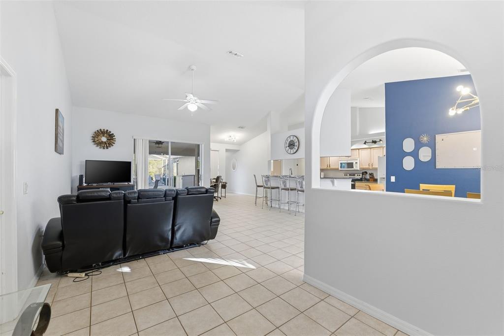 5220 Kirkwood Avenue Spring Hill, FL 34608 - Photo 6 of 67 a living room with furniture and a flat screen tv