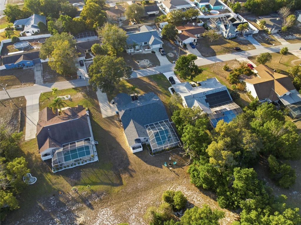 5220 Kirkwood Avenue Spring Hill, FL 34608 - Photo 62 of 67 an aerial view of residential houses with outdoor space