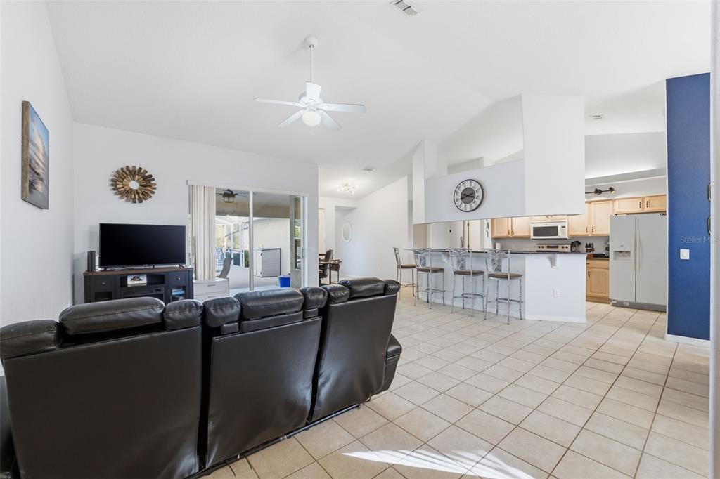 5220 Kirkwood Avenue Spring Hill, FL 34608 - Photo 7 of 67 a living room with furniture and a flat screen tv