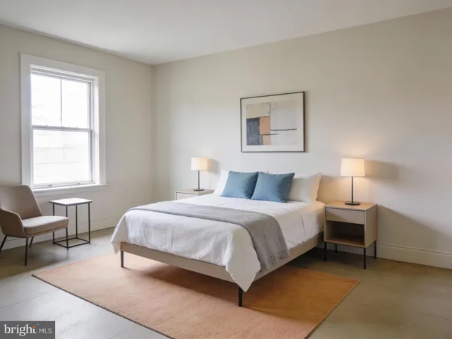 a bedroom with a bed and a couch