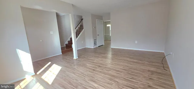 a view of entryway with wooden floor