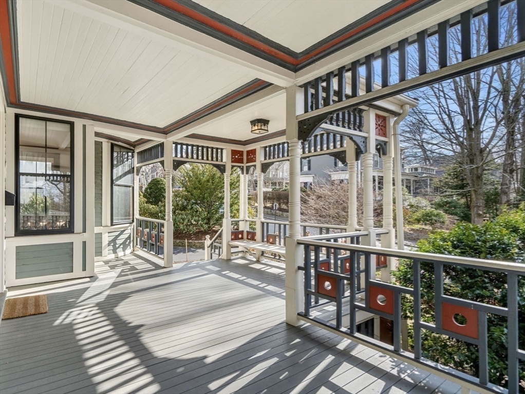 44 Putnam Street Newton, MA 02465 - Photo 2 of 38 a bedroom with furniture and a large window