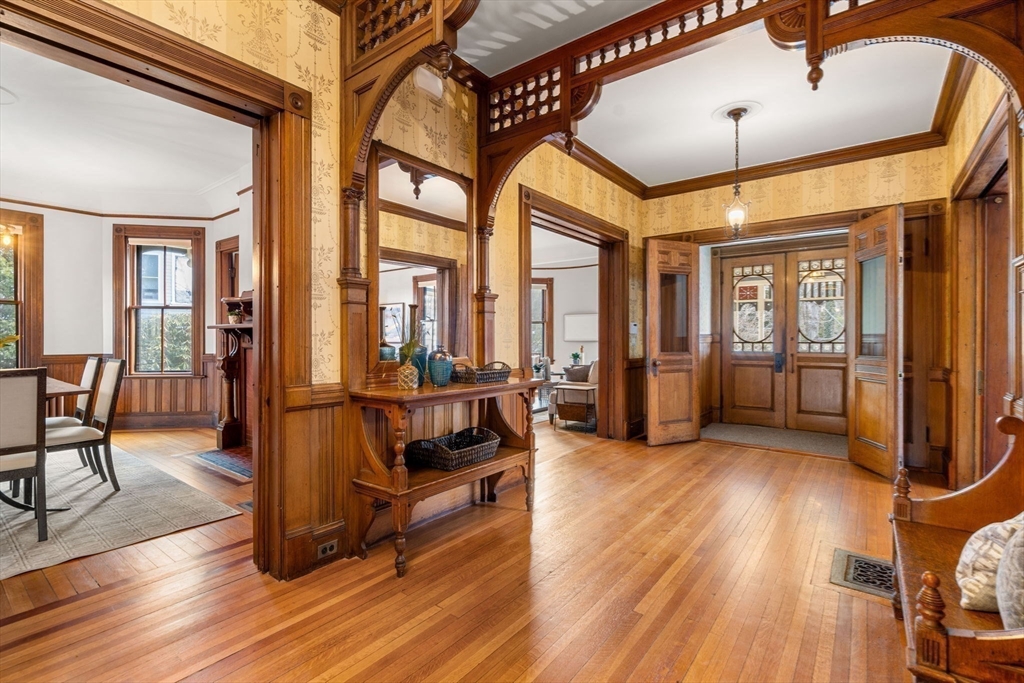 44 Putnam Street Newton, MA 02465 - Photo 3 of 38 a view of a livingroom with furniture wooden floor and windows