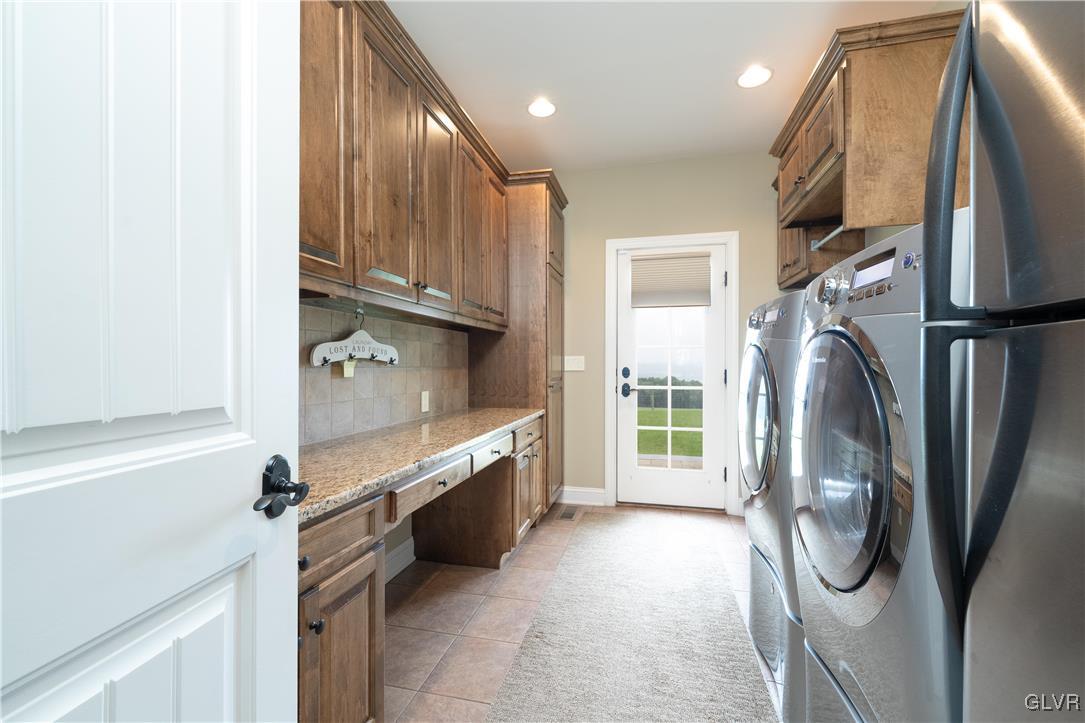 53 Airport Road Millville, PA 17846 - Photo 26 of 77 a kitchen with stainless steel appliances granite countertop a refrigerator and a sink
