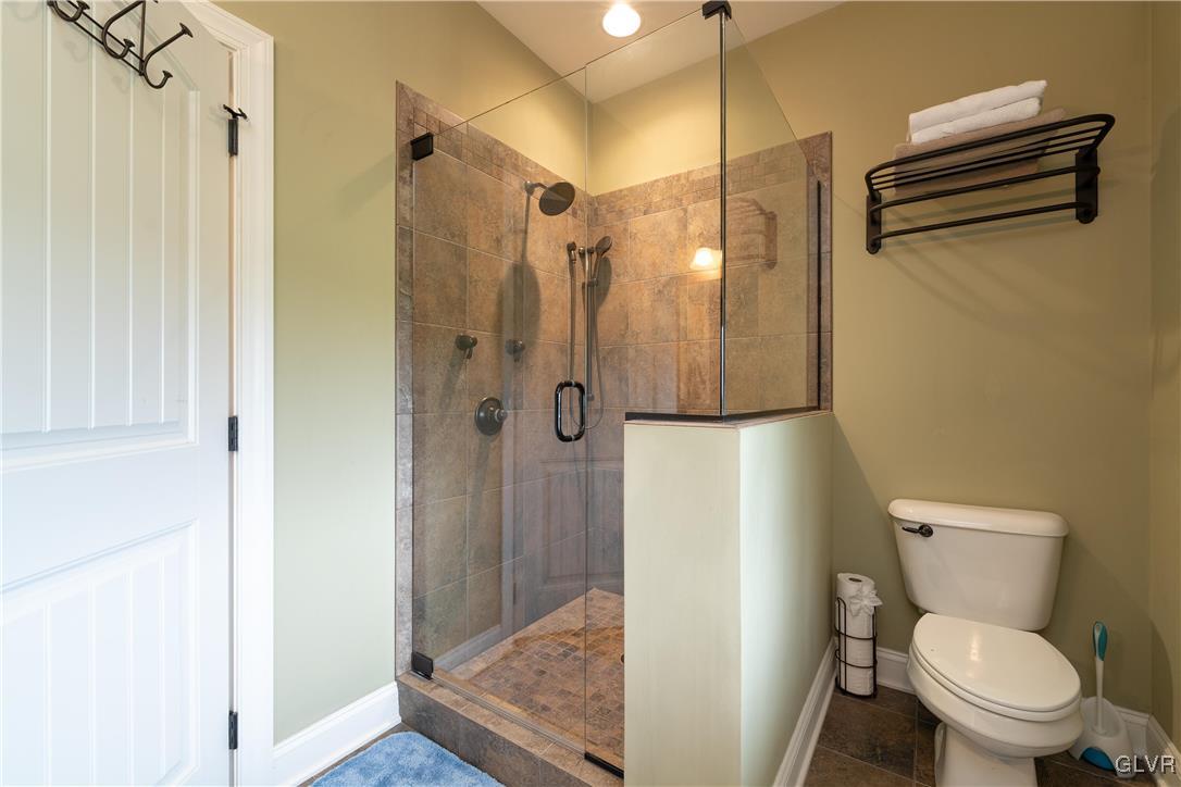 53 Airport Road Millville, PA 17846 - Photo 31 of 77 a bathroom with a toilet and a shower