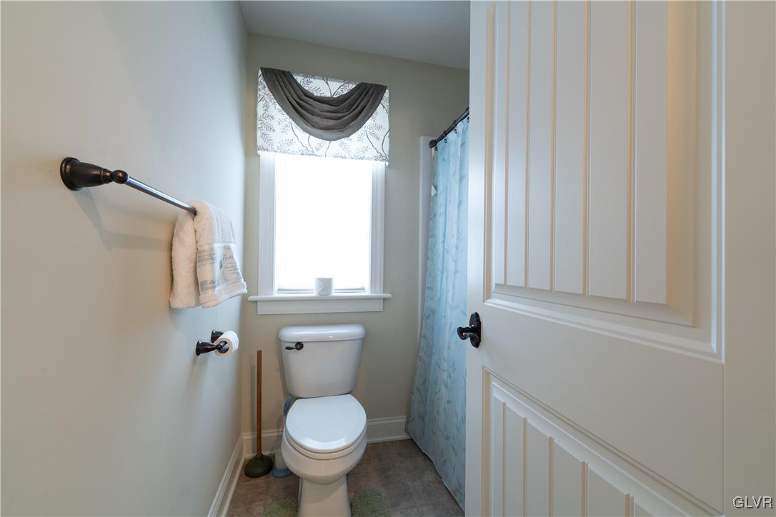 53 Airport Road Millville, PA 17846 - Photo 36 of 77 a bathroom with a toilet and a mirror