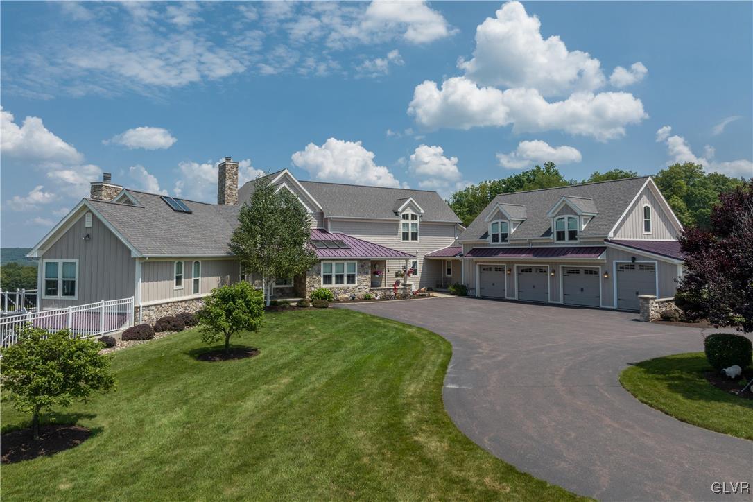 53 Airport Road Millville, PA 17846 - Photo 41 of 77 a view of a big house with a big yard plants and large trees