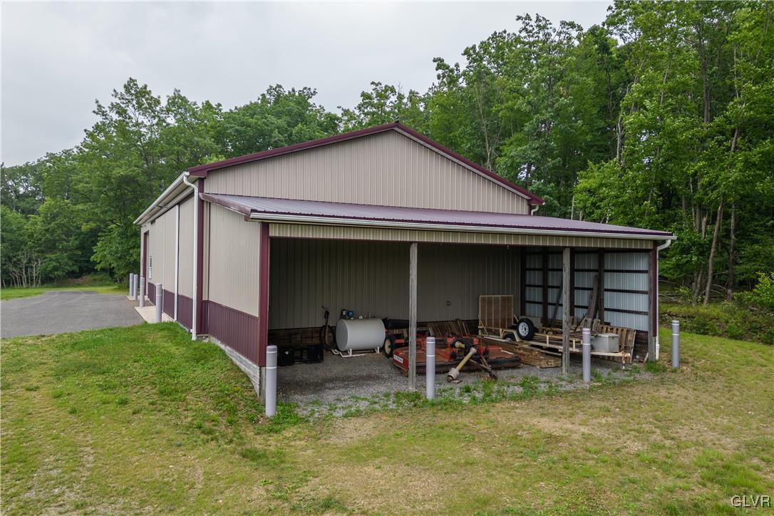 53 Airport Road Millville, PA 17846 - Photo 53 of 77 a view of a chair and table in backyard of house