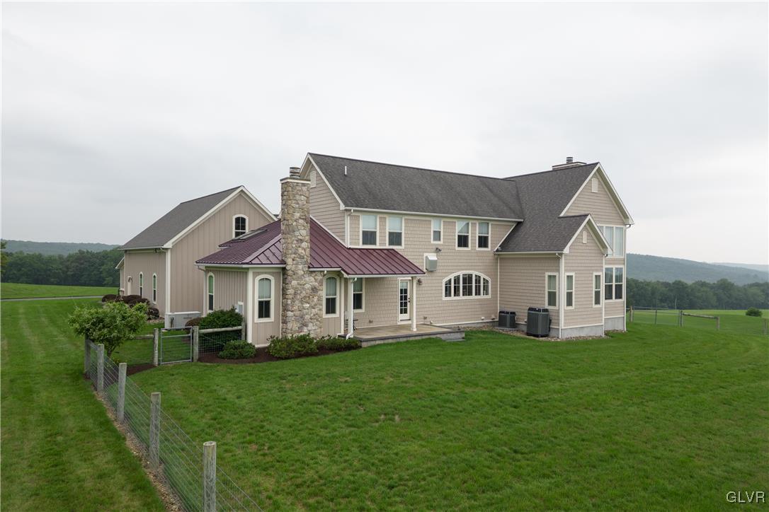 53 Airport Road Millville, PA 17846 - Photo 56 of 77 a front view of a house with a garden and trees