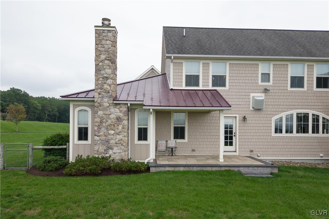 53 Airport Road Millville, PA 17846 - Photo 57 of 77 a front view of a house with a garden and yard