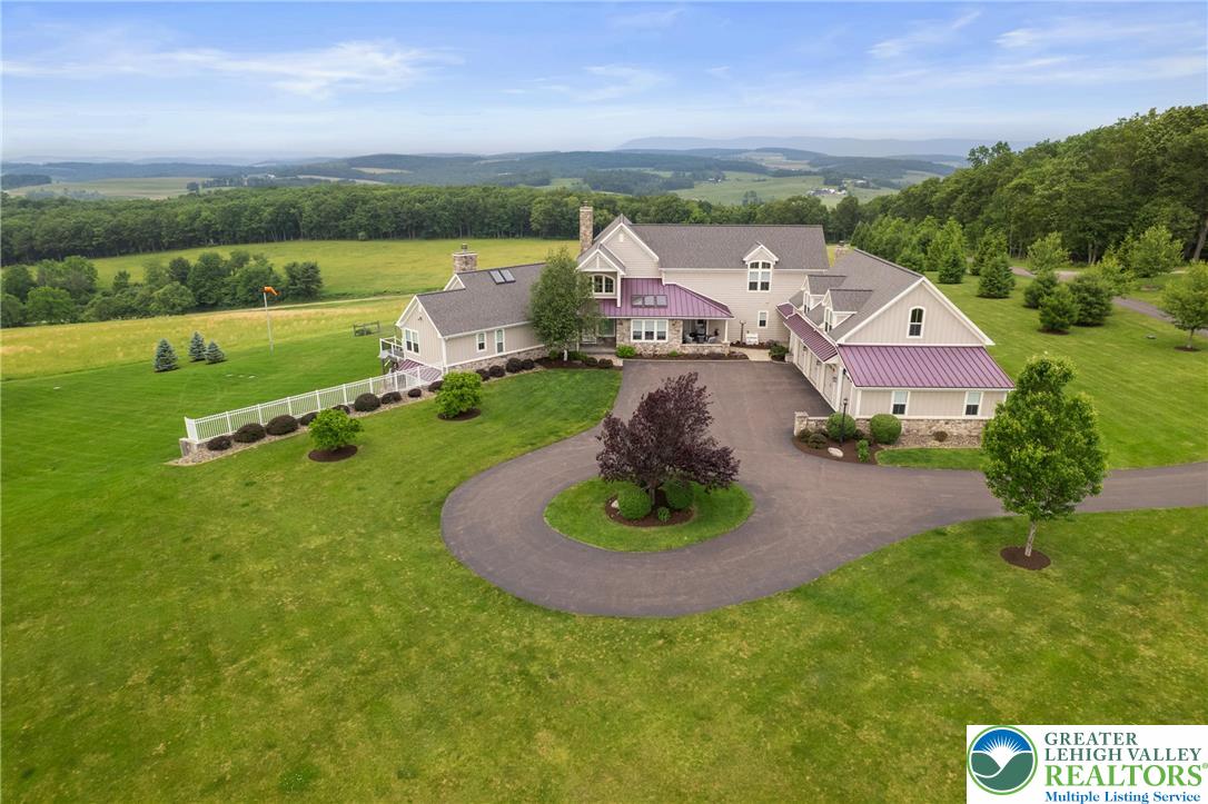 53 Airport Road Millville, PA 17846 - Photo 62 of 77 an aerial view of a house with a garden and outdoor seating