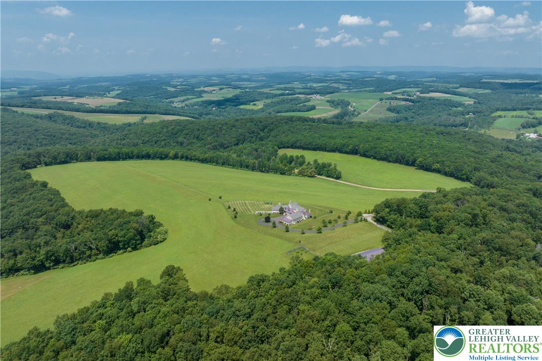 53 Airport Road Millville, PA 17846 - Photo 71 of 77 an aerial view of a residential houses with outdoor space and trees all around