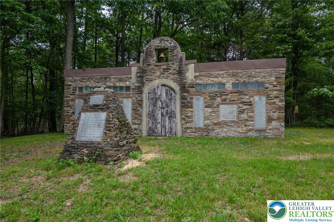 53 Airport Road Millville, PA 17846 - Photo 76 of 77 a front view of a house with a garden