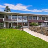 a view of house with a yard