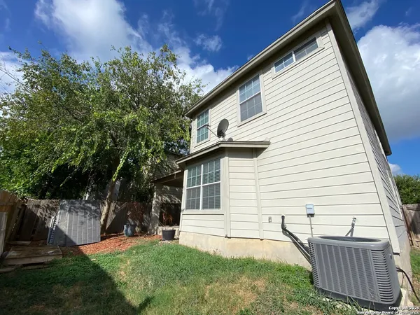 a backyard of a house with seating space